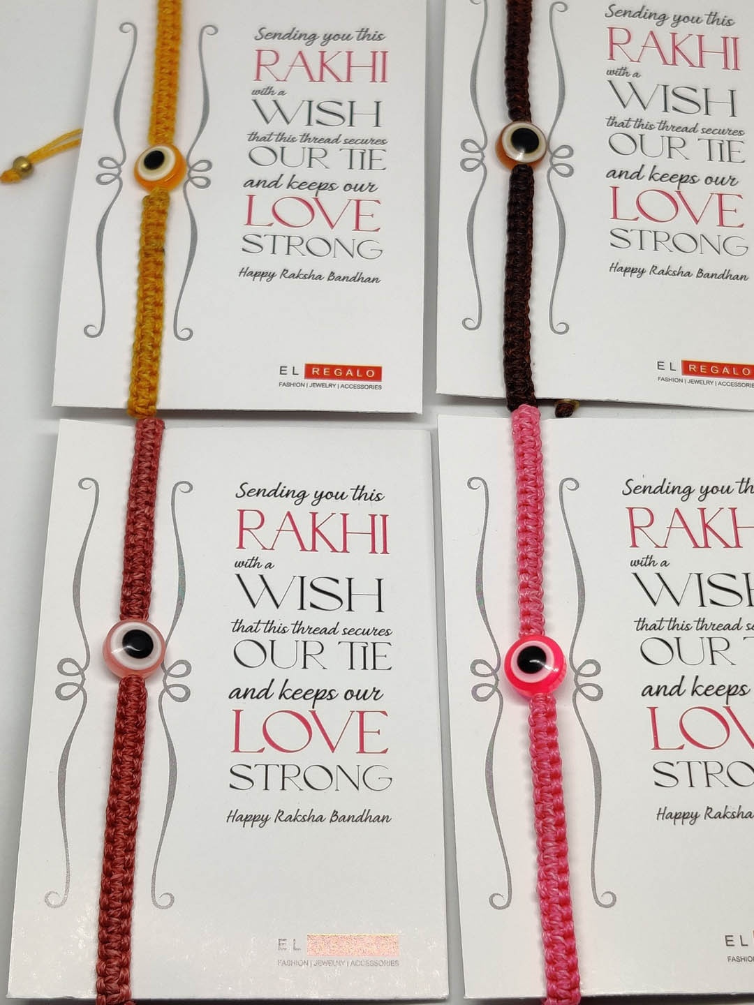 EL REGALO Set Of 4 Evil Eye Wrap Around Rakhi With Roli Chawal & Raksha Bandhan Greeting Card, Pink
EL REGALO Set Of 4 Evil Eye Wrap Around Rakhi With Roli Chawal & Raksha Bandhan Greeting Card, Pink