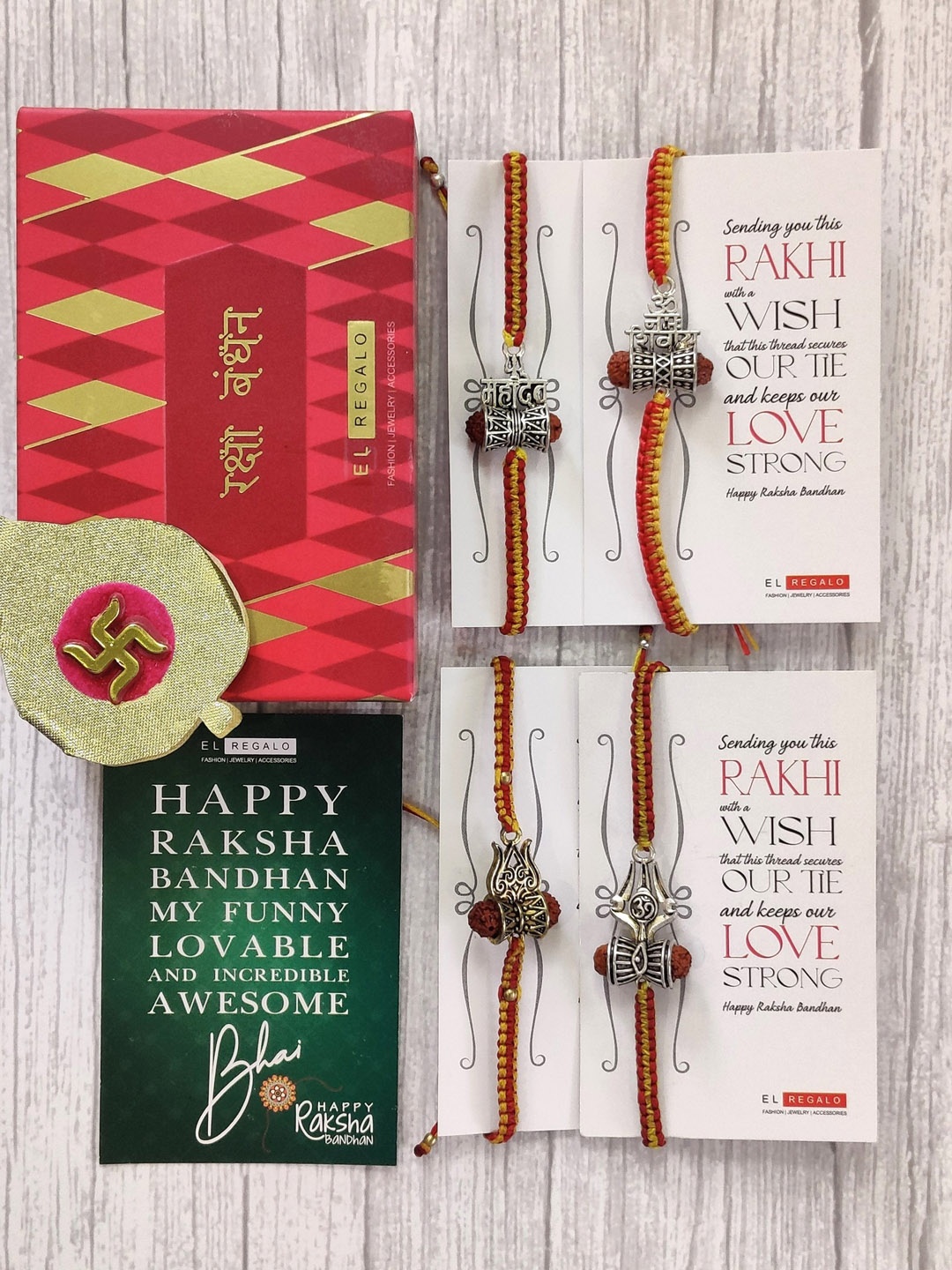 EL REGALO Set Of 4 Red & Silver Coloured Rudrakh Wrap Around Rakhi With Roli Chawal & Raksha Bandhan Greeting Card
EL REGALO Set Of 4 Red & Silver Coloured Rudrakh Wrap Around Rakhi With Roli Chawal & Raksha Bandhan Greeting Card