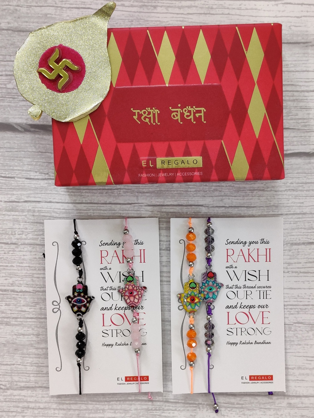 EL REGALO Set Of 4 Evil Eye Beaded Wrap Around Rakhi With Roli Chawal & Greeting Card, Orange
EL REGALO Set Of 4 Evil Eye Beaded Wrap Around Rakhi With Roli Chawal & Greeting Card, Orange