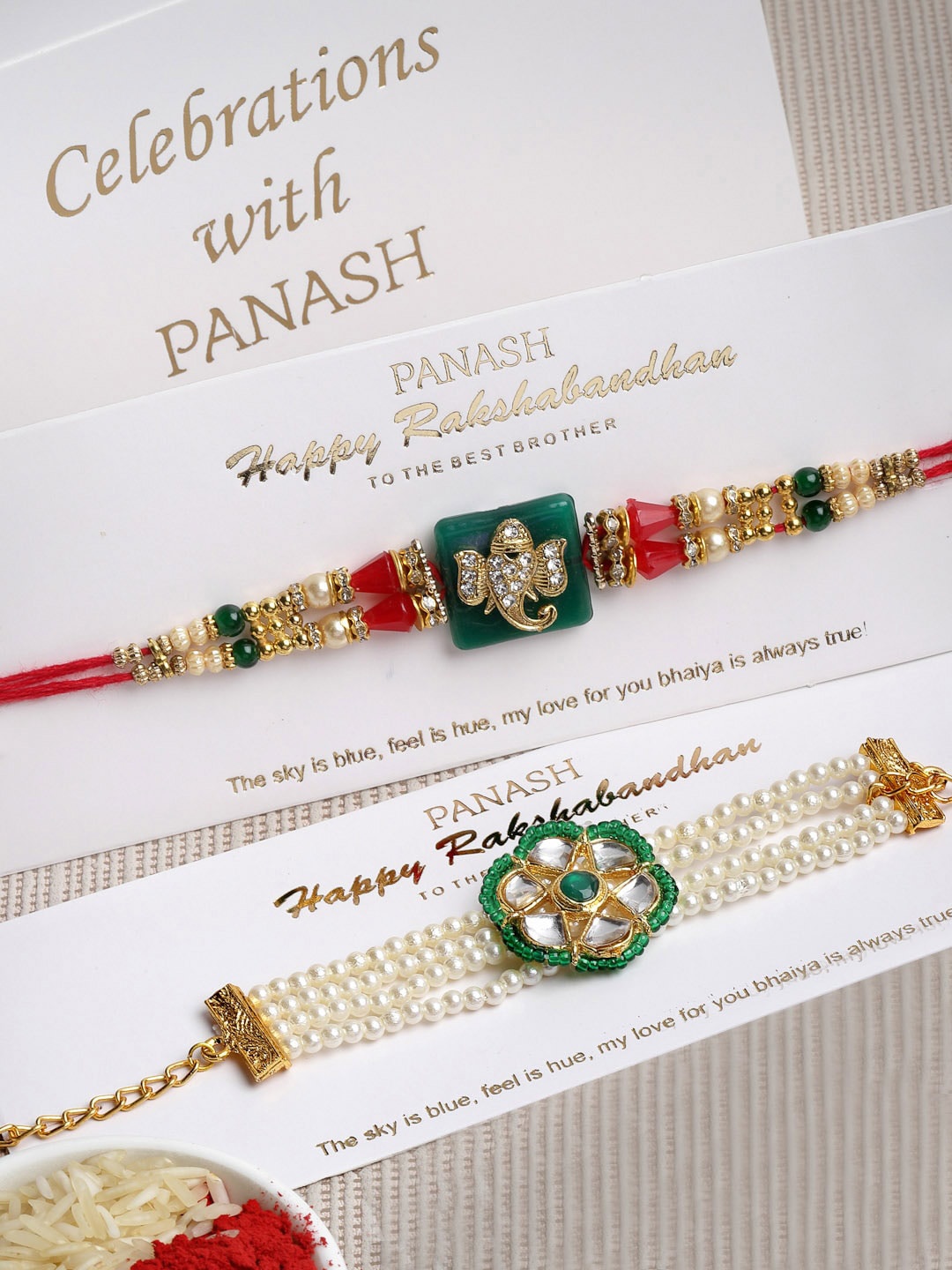 PANASH Set of 2 Gold Coloured, Green & White Bhaiya Bhabhi Embellished Rakhi With Gift Stand
PANASH Set of 2 Gold Coloured, Green & White Bhaiya Bhabhi Embellished Rakhi With Gift Stand