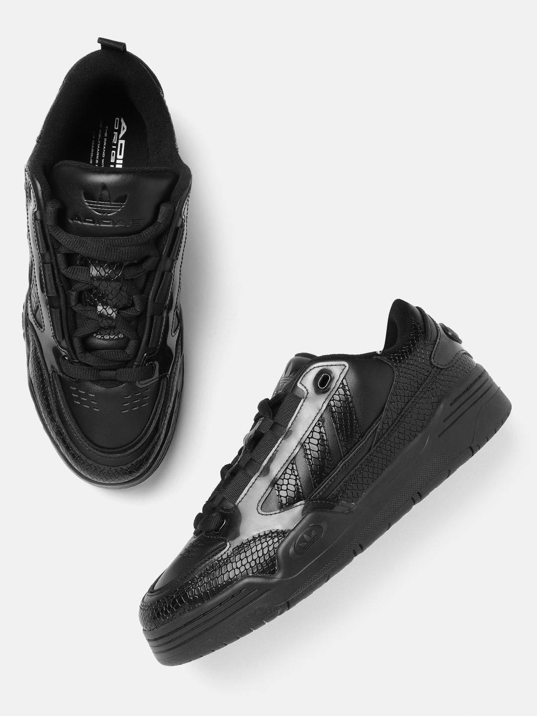 ADIDAS Originals Men Black Snake Skin Textured Adi2000 Ogin Perforated Leather Sneakers
ADIDAS Originals Men Black Snake Skin Textured Adi2000 Ogin Perforated Leather Sneakers