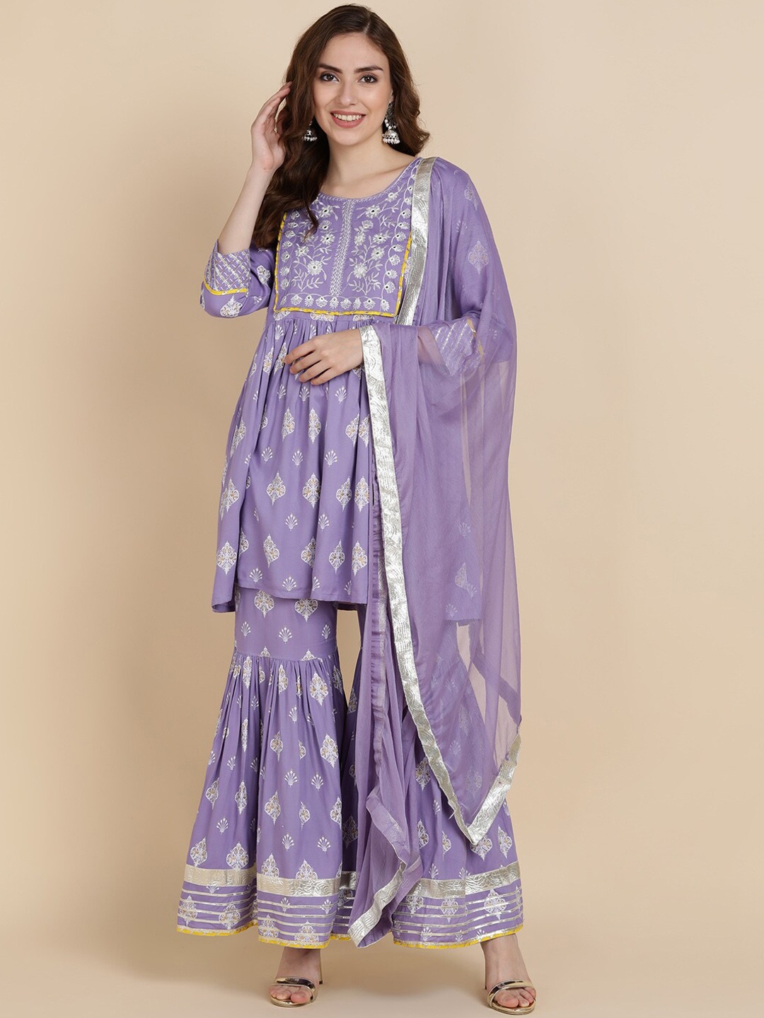 JAIPUR PRIME Women Lavender Floral Yoke Design Empire Kurti with Sharara & With Dupatta
JAIPUR PRIME Women Lavender Floral Yoke Design Empire Kurti with Sharara & With Dupatta