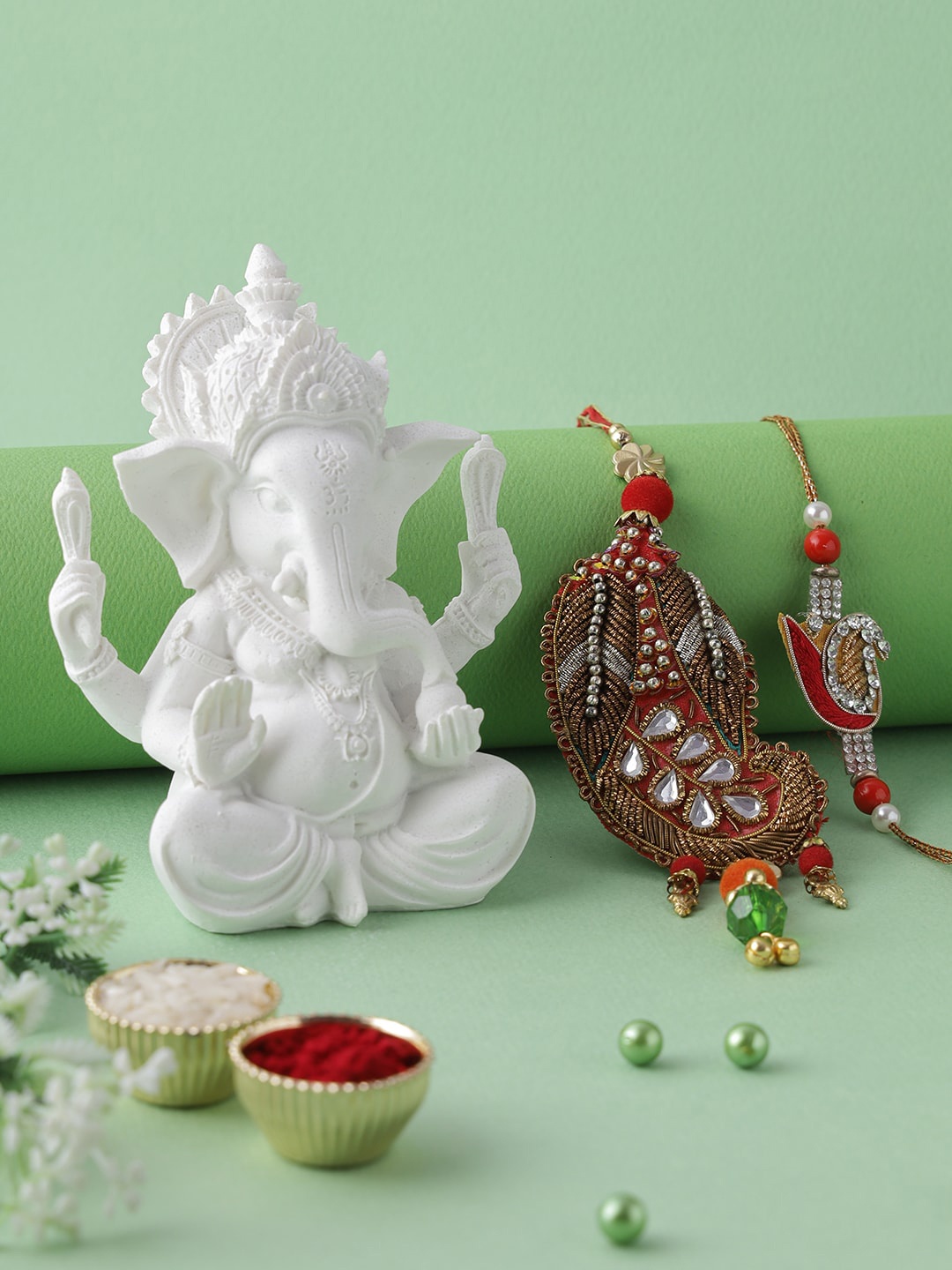 Aapno Rajasthan Multicoloured Bhaiya Bhabhi Rakhi with Polyresin Ganesha Idol Gift Set, Red
Aapno Rajasthan Multicoloured Bhaiya Bhabhi Rakhi with Polyresin Ganesha Idol Gift Set, Red