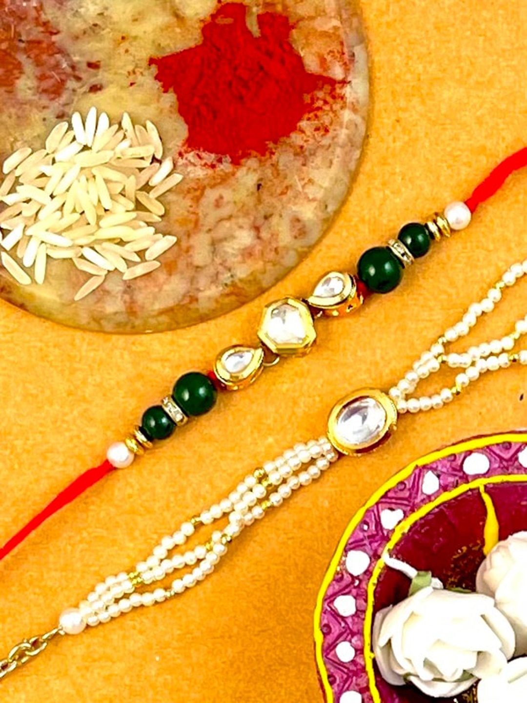 KARATCART Multicoloured Gold-Plated Kundan Studded Bhaiya Bhabhi Rakhi with Roli Chawal, Multi
KARATCART Multicoloured Gold-Plated Kundan Studded Bhaiya Bhabhi Rakhi with Roli Chawal, Multi