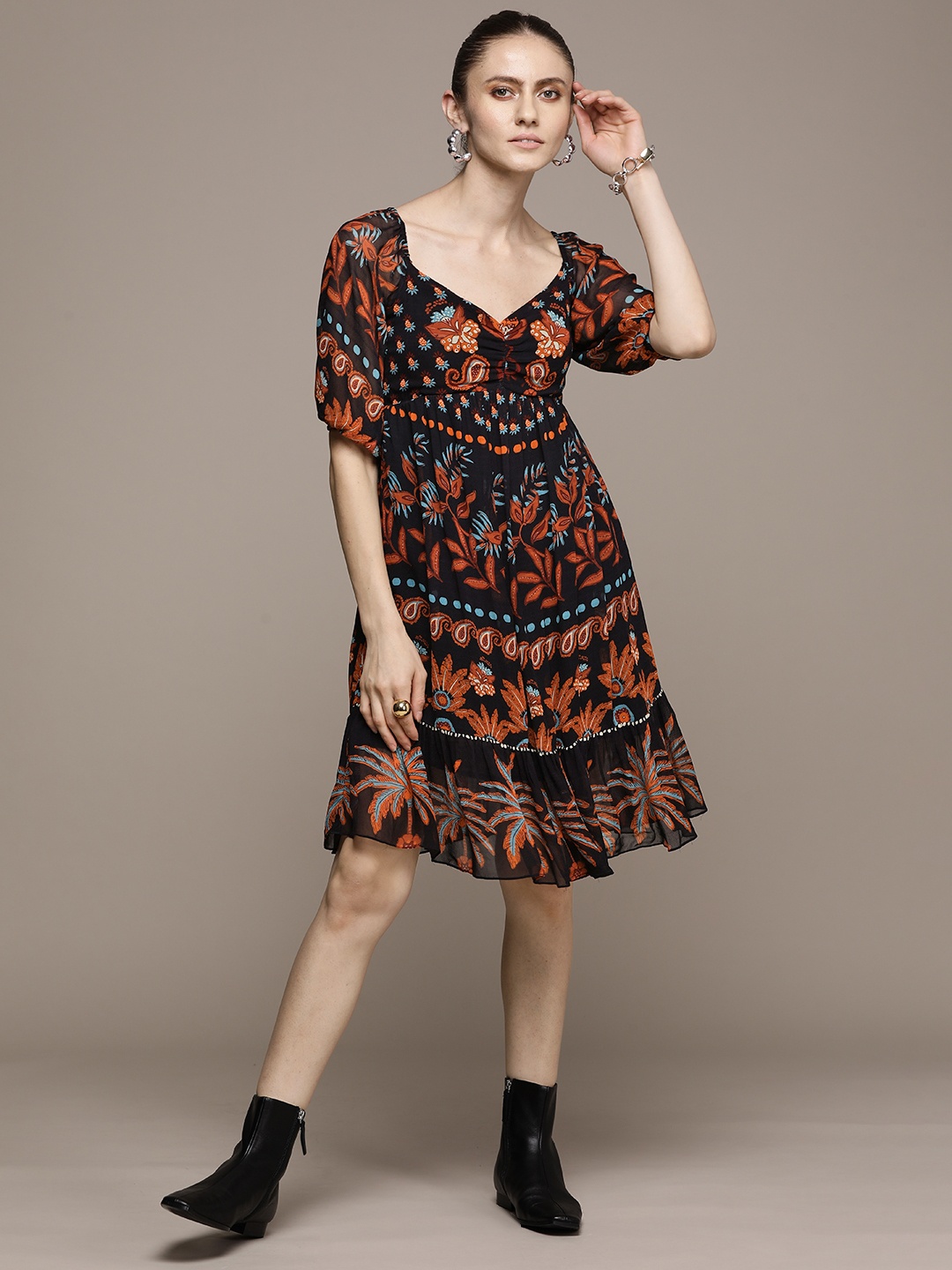 Label Ritu Kumar Black & Orange Ethnic Motifs Printed Smocked Georgette A-Line Dress
Label Ritu Kumar Black & Orange Ethnic Motifs Printed Smocked Georgette A-Line Dress
