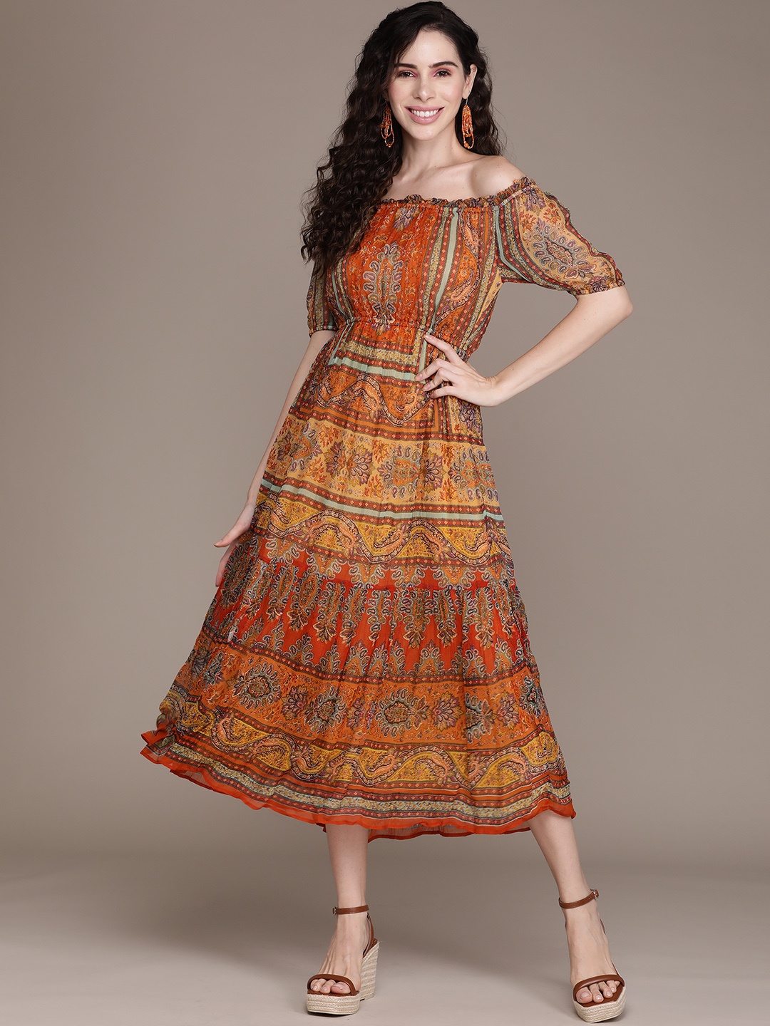 Label Ritu Kumar Orange & Brown Ethnic Motifs Off-Shoulder Chiffon A-Line Midi Dress
Label Ritu Kumar Orange & Brown Ethnic Motifs Off-Shoulder Chiffon A-Line Midi Dress