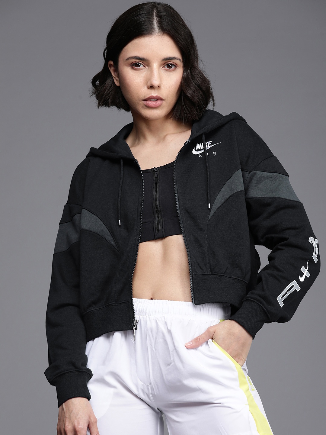 Nike Women Black & Charcoal Grey Solid Air Oversized Hooded Sporty Jacket with Panelling
Nike Women Black & Charcoal Grey Solid Air Oversized Hooded Sporty Jacket with Panelling