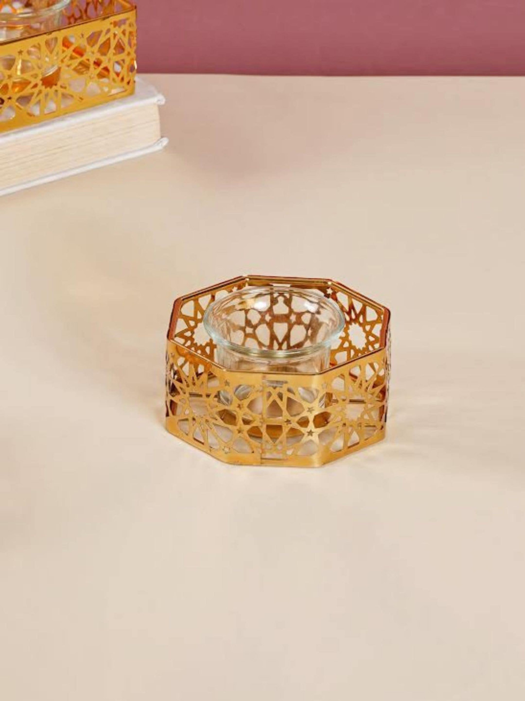 Nestasia Gold and Transparent Octagon Metal And Glass Candle Stand
Nestasia Gold and Transparent Octagon Metal And Glass Candle Stand