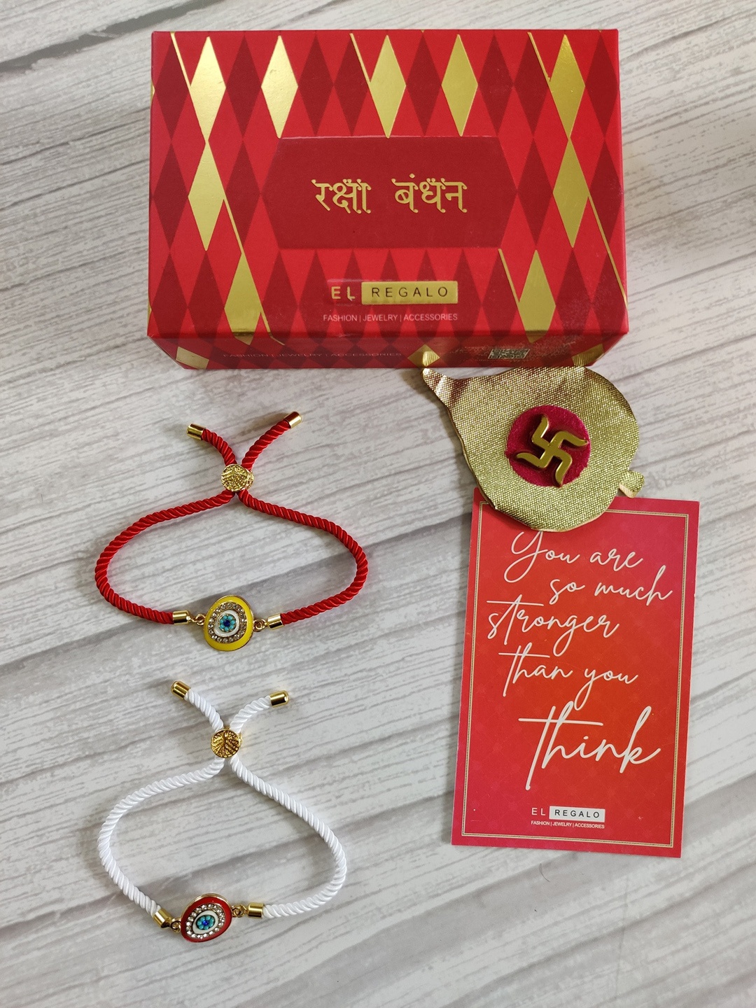 EL REGALO Set of 2 Gold-Plated Red & White Eye Eye Rakhi With Greeting card Roli & Chawal
EL REGALO Set of 2 Gold-Plated Red & White Eye Eye Rakhi With Greeting card Roli & Chawal