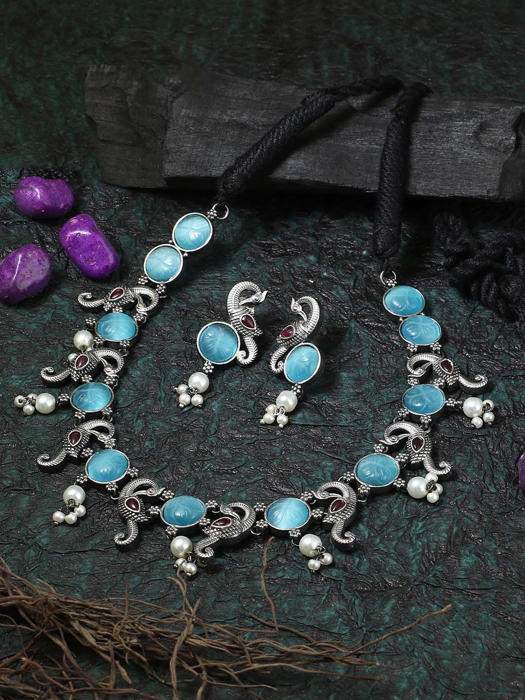 Adwitiya Collection Silver-Plated Blue Stone Studded & Beaded Oxidized Peacock Jewellery Set
Adwitiya Collection Silver-Plated Blue Stone Studded & Beaded Oxidized Peacock Jewellery Set