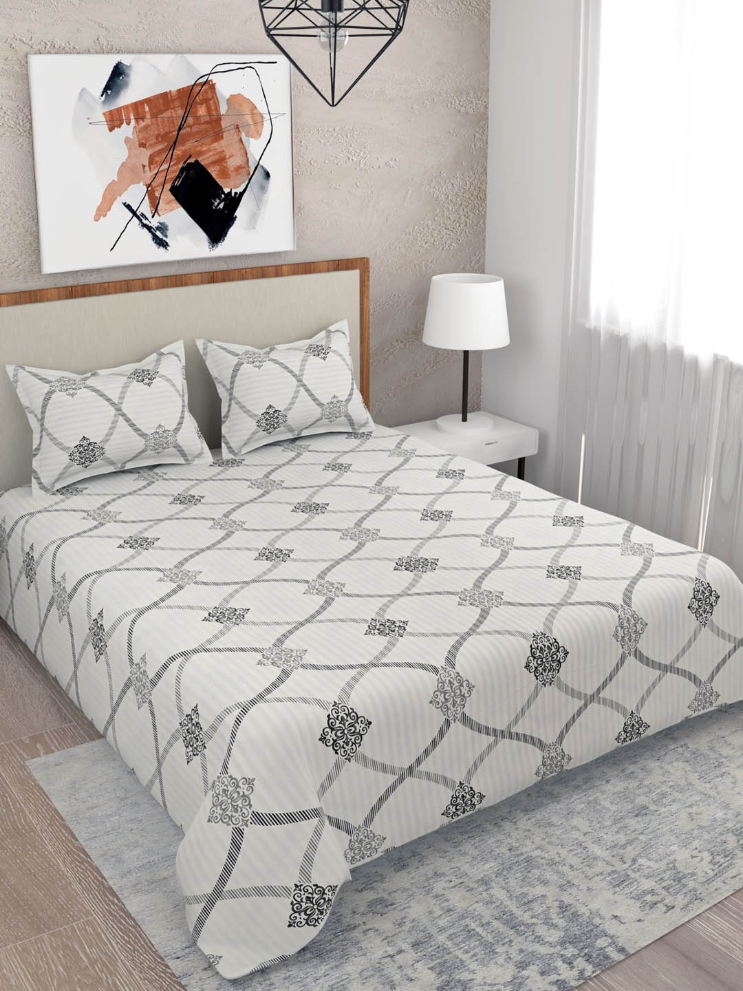 Salona Bichona Grey & White Printed 210 TC King Cotton Bedsheet with 2 Pillow Covers
Salona Bichona Grey & White Printed 210 TC King Cotton Bedsheet with 2 Pillow Covers