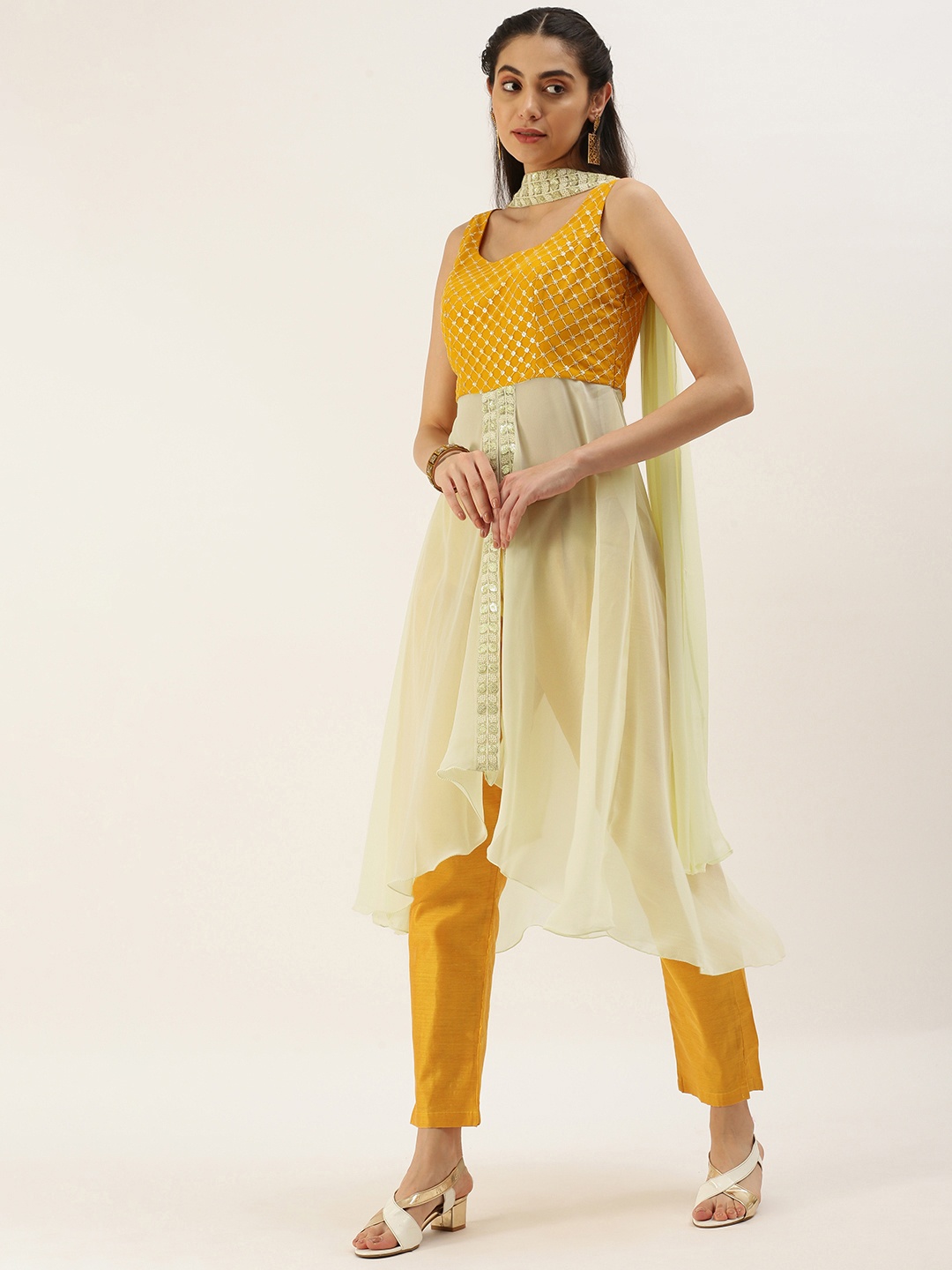 Ethnovog Women Embroidered High Slit Sequinned Kurta with Trousers With Dupatta, Off white
Ethnovog Women Embroidered High Slit Sequinned Kurta with Trousers With Dupatta, Off white