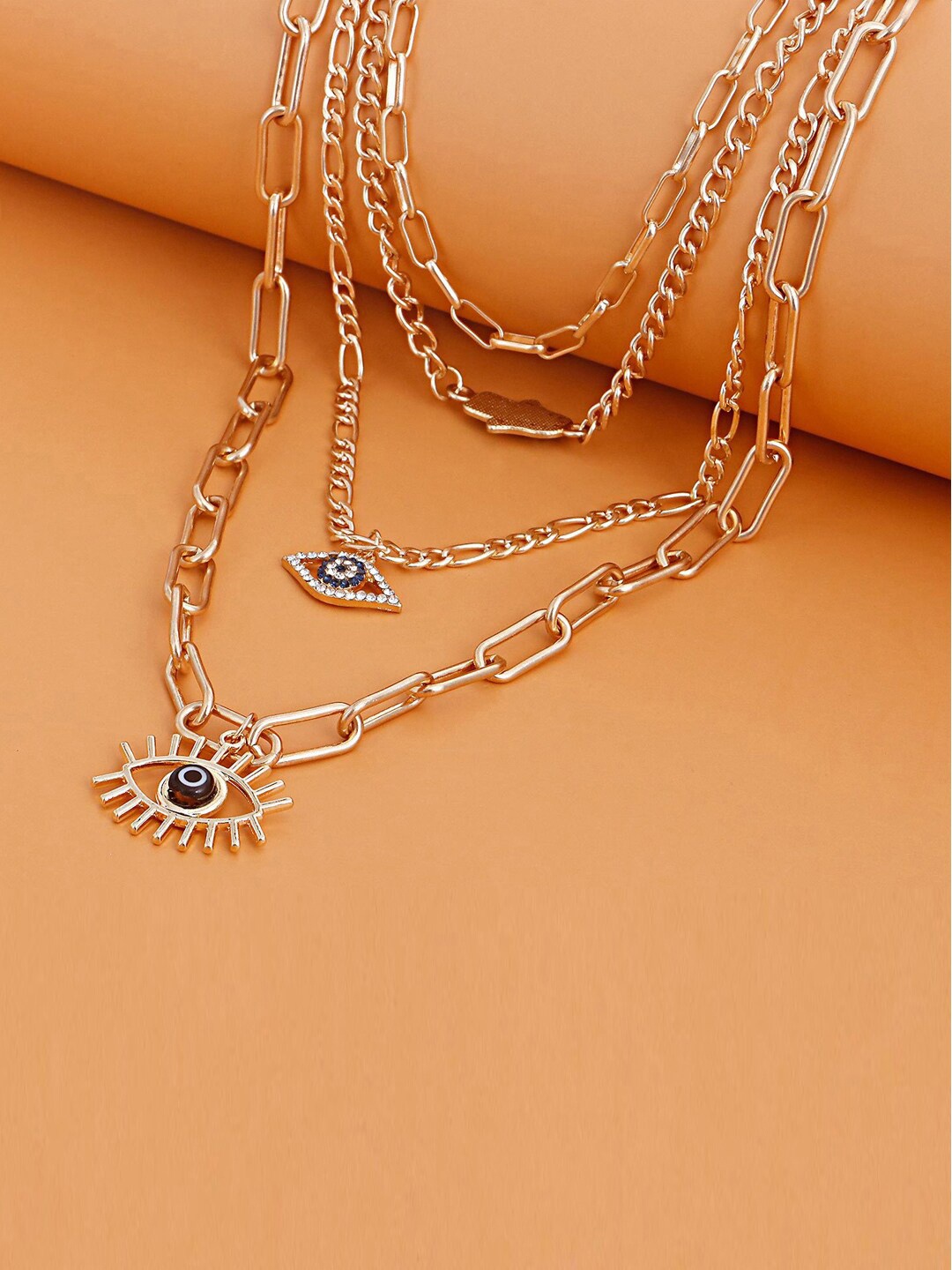 Jewels Galaxy Gold-Toned & Blue Gold-Plated Evil Eye and Buddha Hand Layered Necklace
Jewels Galaxy Gold-Toned & Blue Gold-Plated Evil Eye and Buddha Hand Layered Necklace