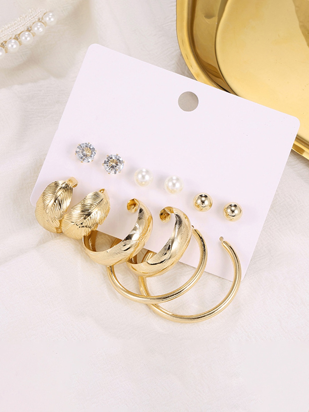 Vembley Pack of 6 Pair Stylish Gold Plated Big Pearl Studded Studs and Plain Hoop Earring
Vembley Pack of 6 Pair Stylish Gold Plated Big Pearl Studded Studs and Plain Hoop Earring