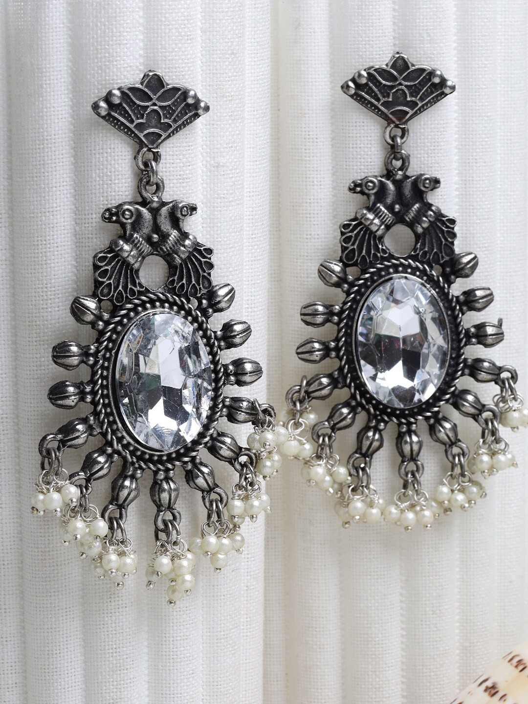 Moedbuille Silver Plated Crystals & Pearls Studded Oxidised Handcrafted Antique Earrings
Moedbuille Silver Plated Crystals & Pearls Studded Oxidised Handcrafted Antique Earrings