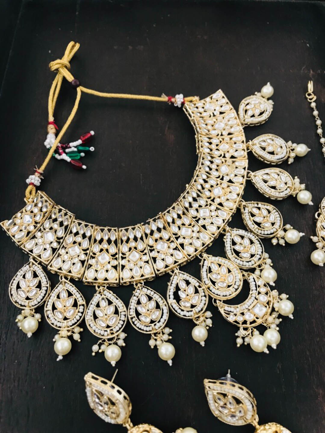 The Opal Factory Women Gold-Plated White Stone-Studded Jewellery Set with Mang Tikka
The Opal Factory Women Gold-Plated White Stone-Studded Jewellery Set with Mang Tikka