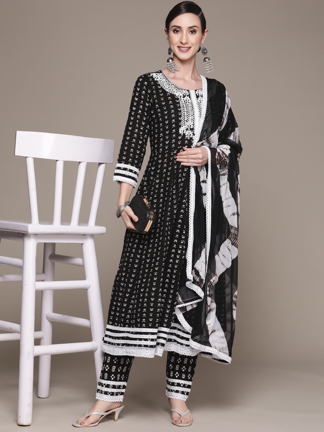 Ishin Women Black Floral Printed Pleated Thread Work Kurta with Trousers & With Dupatta
Ishin Women Black Floral Printed Pleated Thread Work Kurta with Trousers & With Dupatta