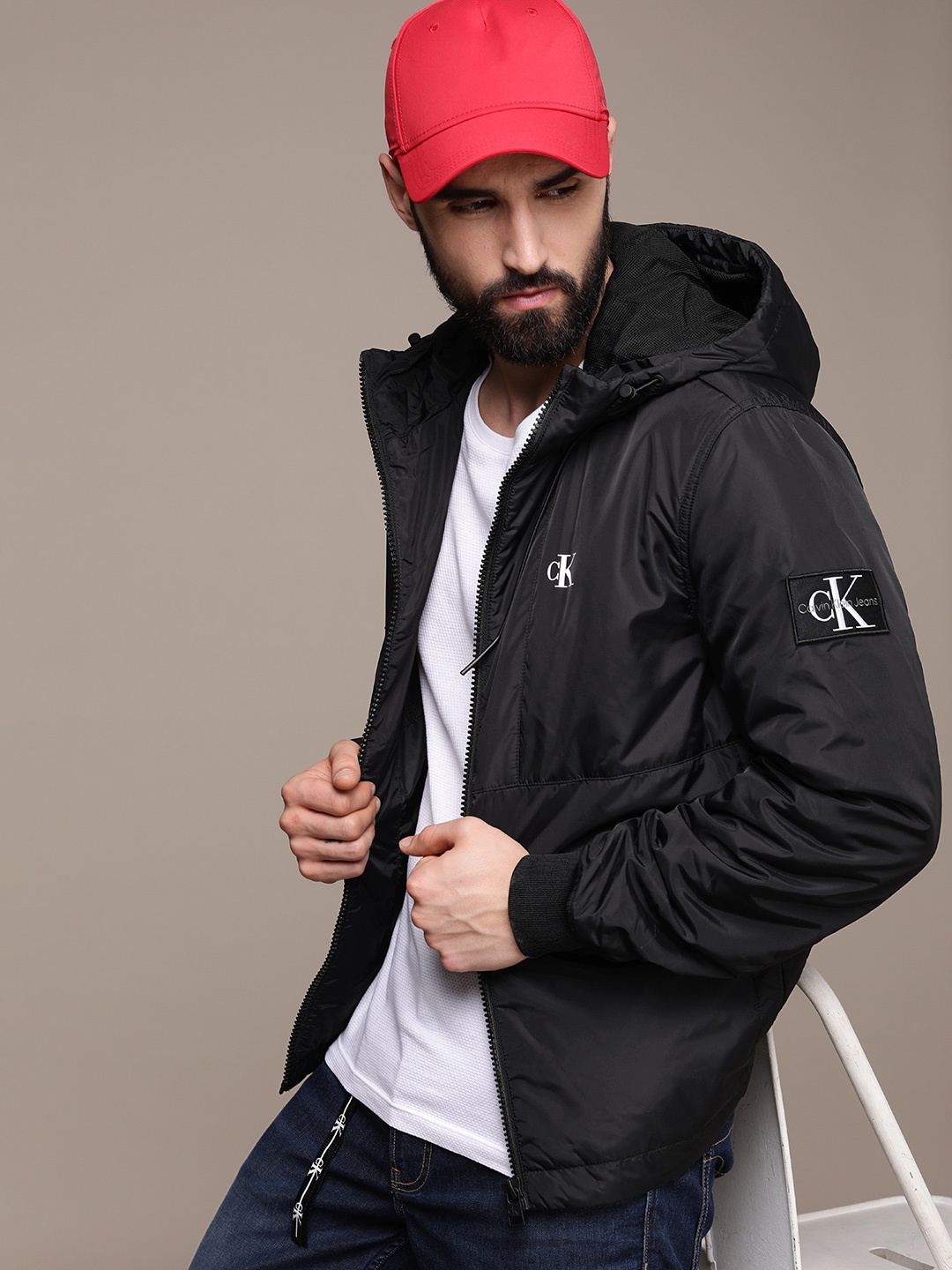 Calvin Klein Jeans Men Black Brand Logo Printed Harrington Padded Jacket with Patchwork
Calvin Klein Jeans Men Black Brand Logo Printed Harrington Padded Jacket with Patchwork
