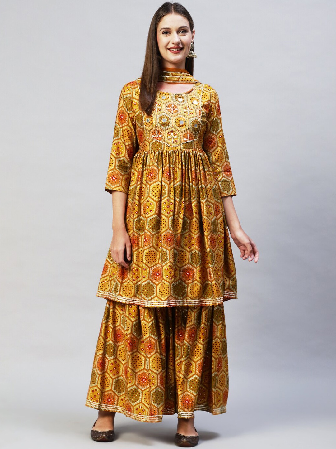 FASHOR Women Mustard Yellow Ethnic Motifs Printed Mirror Work Kurta with Sharara & With Dupatta
FASHOR Women Mustard Yellow Ethnic Motifs Printed Mirror Work Kurta with Sharara & With Dupatta