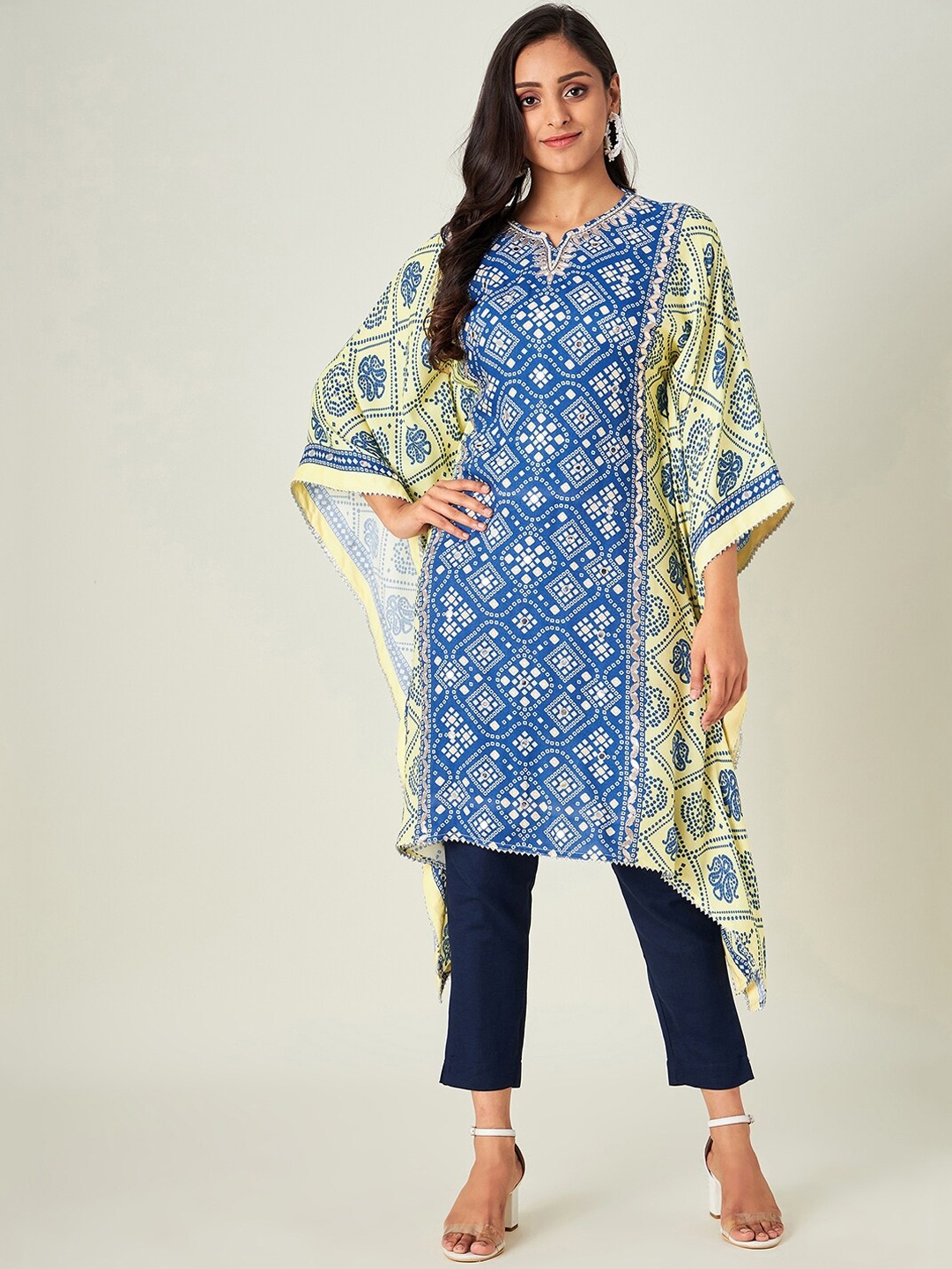 The Kaftan Company Women Blue & Yellow Bandhani Printed Flared Sleeves Mirror Work Kaftan Kurta
The Kaftan Company Women Blue & Yellow Bandhani Printed Flared Sleeves Mirror Work Kaftan Kurta