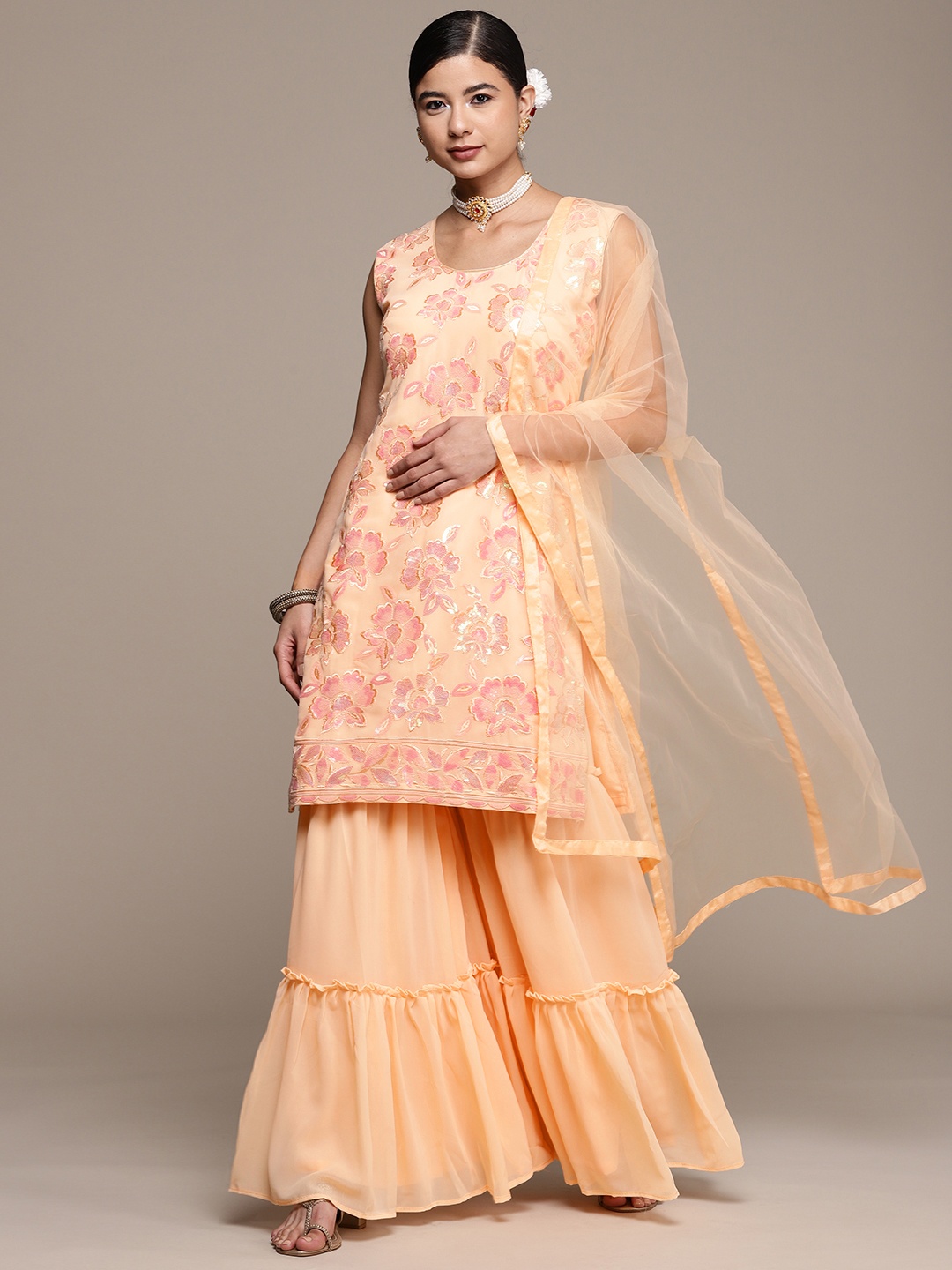 SAARYA Women Peach-Coloured Floral Embroidered Sequinned Kurta with Sharara & With Dupatta
SAARYA Women Peach-Coloured Floral Embroidered Sequinned Kurta with Sharara & With Dupatta