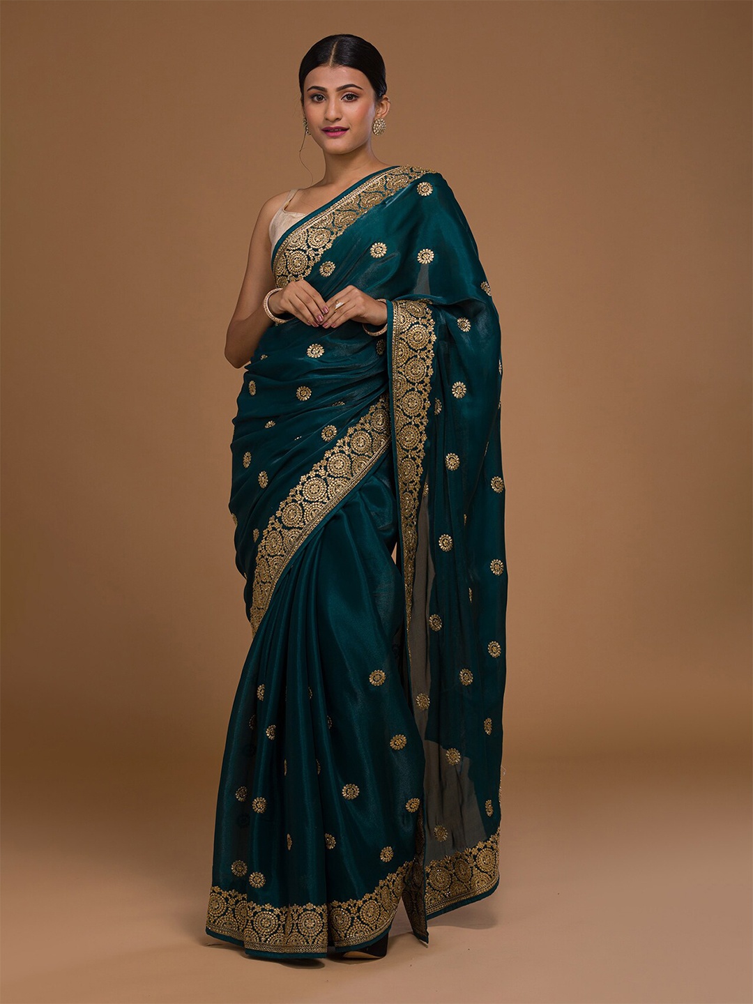 Koskii Teal & Gold Embellished Embroidered Art Silk Saree With Unstitched Blouse Piece
Koskii Teal & Gold Embellished Embroidered Art Silk Saree With Unstitched Blouse Piece
