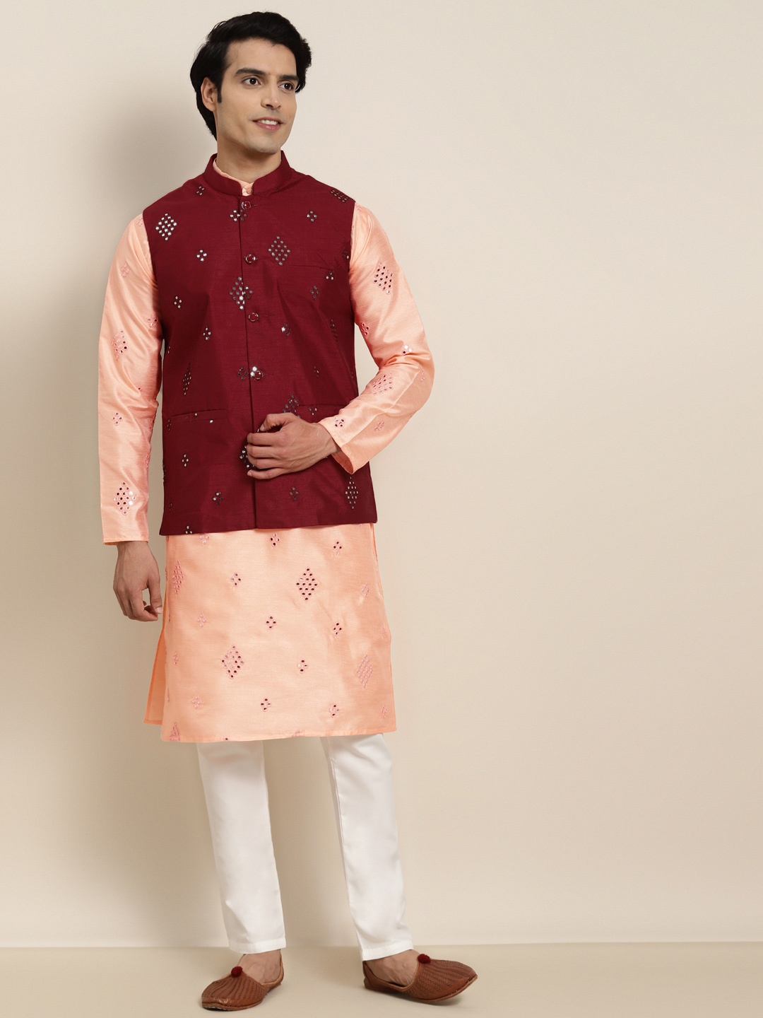SOJANYA Men Peach-Coloured Embroidered Mirror Work Kurta with Pyjamas & Nehru Jacket
SOJANYA Men Peach-Coloured Embroidered Mirror Work Kurta with Pyjamas & Nehru Jacket