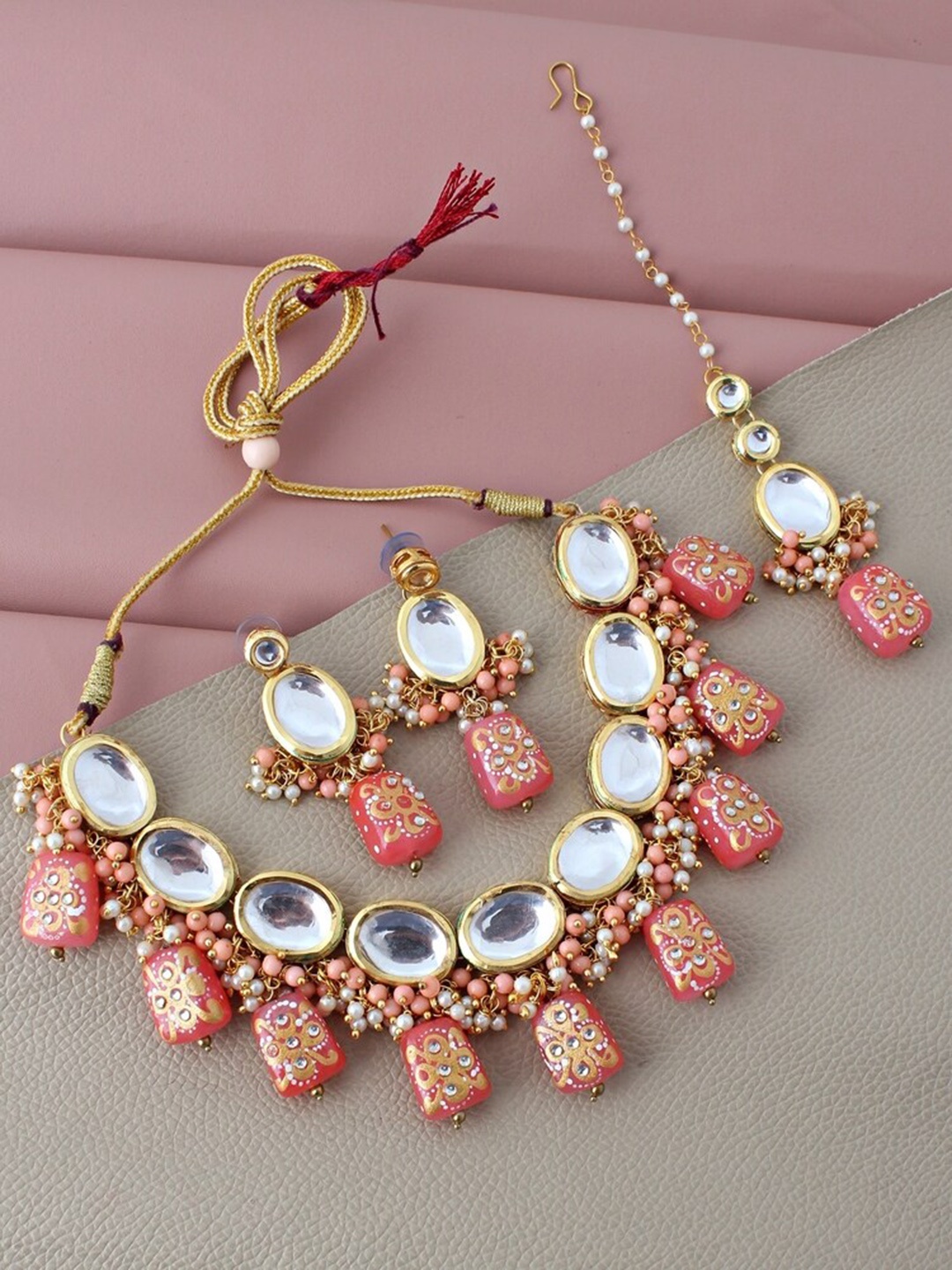 LUCKY JEWELLERY Gold-Plated Peach Kundan-Studded & Beaded Jewellery Set With Maang Tika
LUCKY JEWELLERY Gold-Plated Peach Kundan-Studded & Beaded Jewellery Set With Maang Tika
