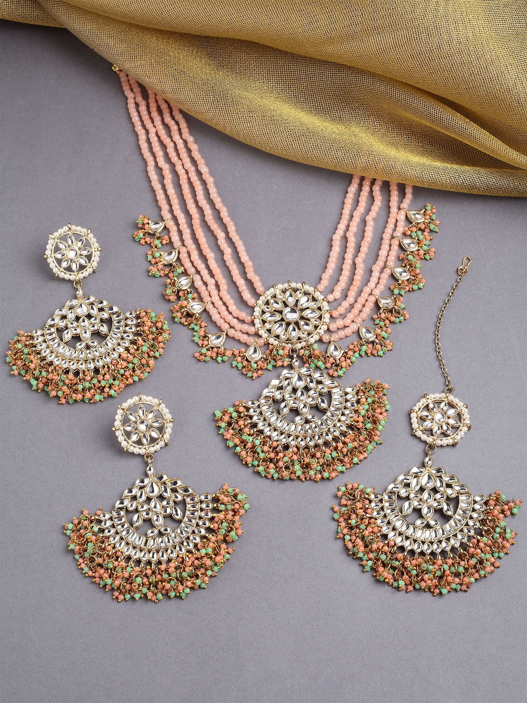 KARATCART Gold-Plated Peach Coloured & Green Kundan Studded & Beaded Handcrafted Jewellery Set
KARATCART Gold-Plated Peach Coloured & Green Kundan Studded & Beaded Handcrafted Jewellery Set