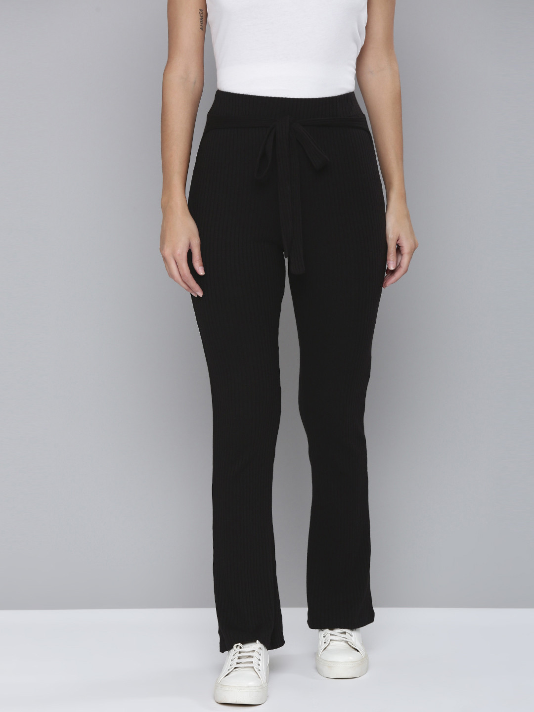 Flying Machine Women Black Striped Bootcut Mid-Rise Knitted Track Pants With Tie-Up Belt
Flying Machine Women Black Striped Bootcut Mid-Rise Knitted Track Pants With Tie-Up Belt