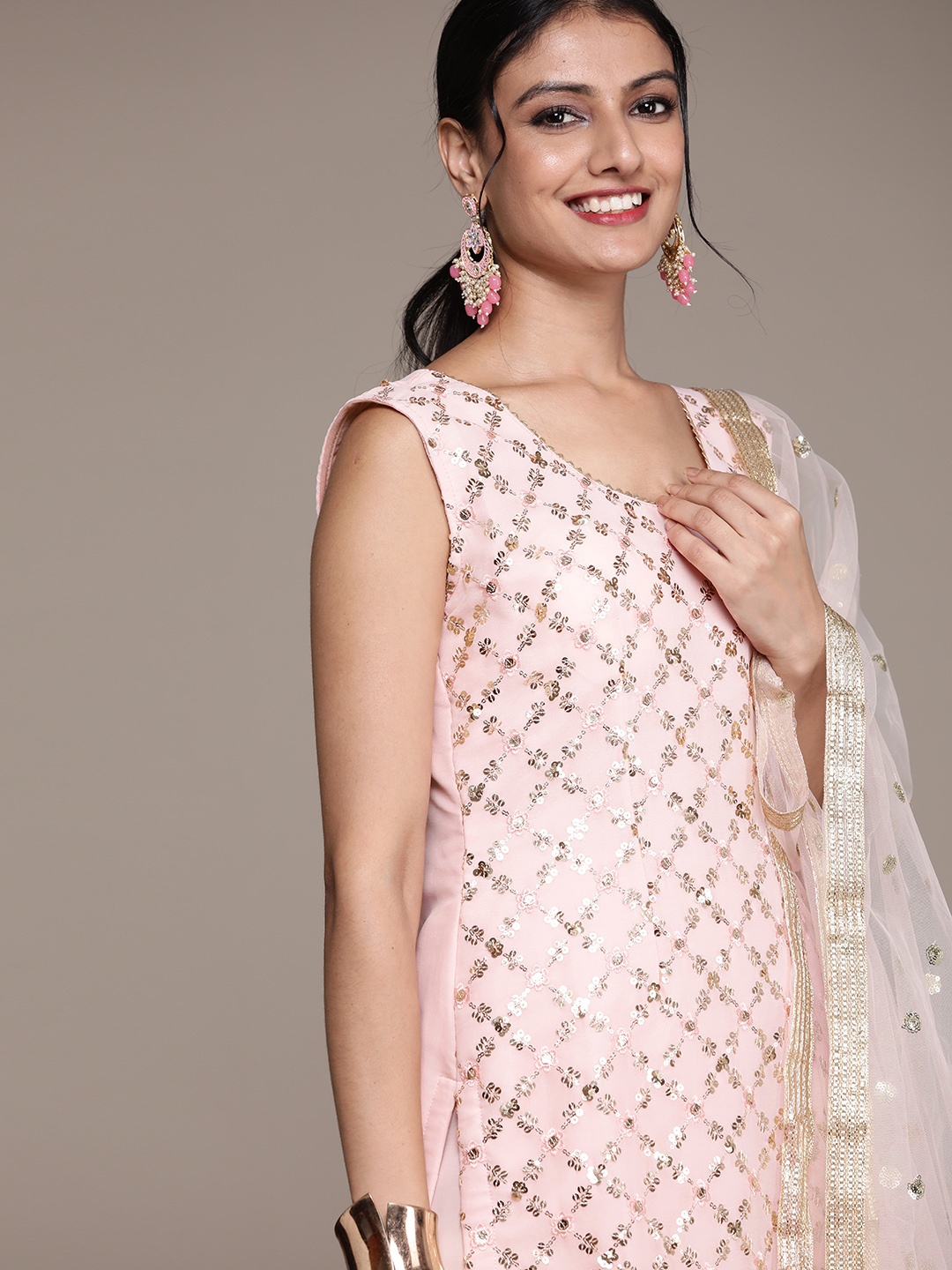 SAARYA Women Peach-Coloured Floral Embroidered Thread Work Kurta with Sharara & With Dupatta
SAARYA Women Peach-Coloured Floral Embroidered Thread Work Kurta with Sharara & With Dupatta
