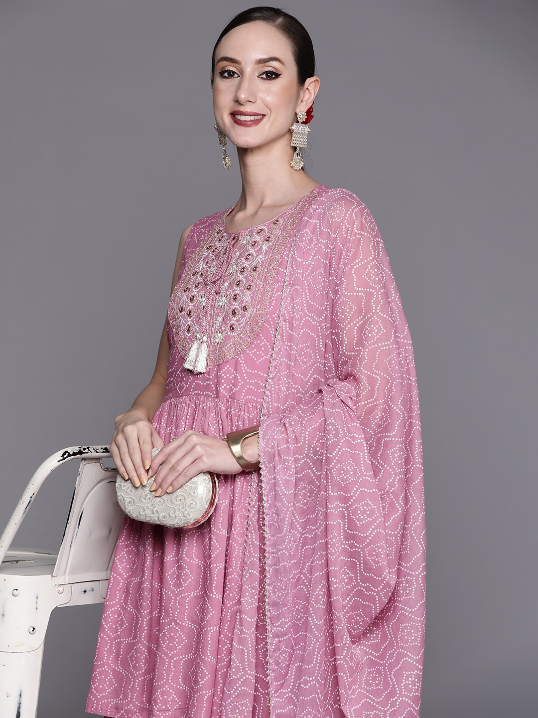 Indo Era Women Lavender Bandhani Embroidered Mirror Work Kurta with Sharara & With Dupatta
Indo Era Women Lavender Bandhani Embroidered Mirror Work Kurta with Sharara & With Dupatta