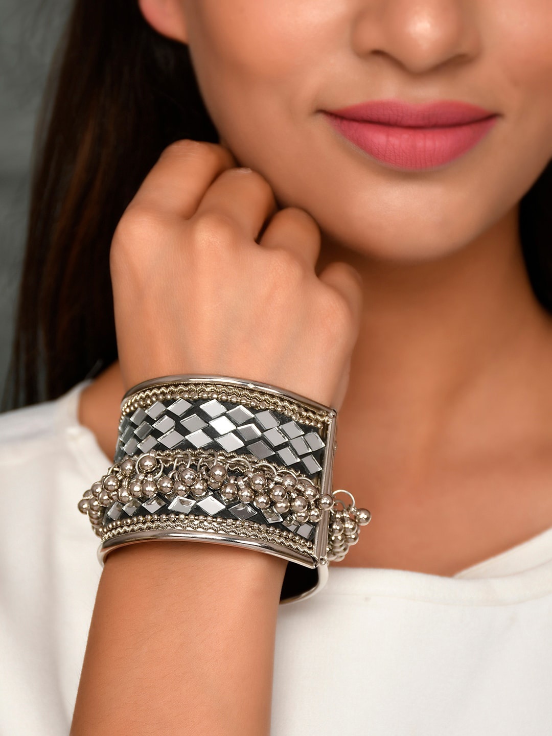 AQUASTREET JEWELS Silver-Plated & Toned Oxidised Mirror Work With Gunghroo Drops Bangle
AQUASTREET JEWELS Silver-Plated & Toned Oxidised Mirror Work With Gunghroo Drops Bangle