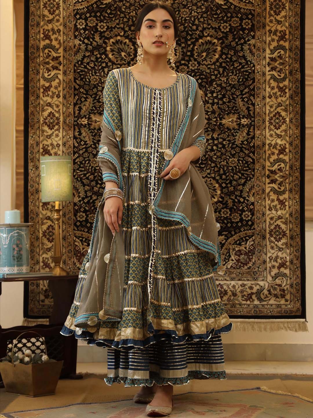SCAKHI Women Floral Printed Tiered Gotta Patti Pure Cotton Kurta with Skirt & With Dupatta, Olive
SCAKHI Women Floral Printed Tiered Gotta Patti Pure Cotton Kurta with Skirt & With Dupatta, Olive