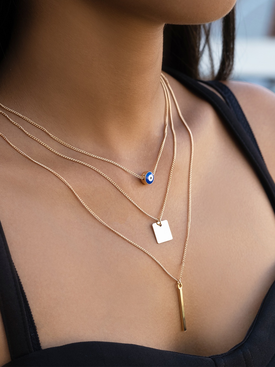 Ayesha Women Gold-Plated & Blue Evil Eye, Square & Bar Charm Pendant Long Layered Necklace
Ayesha Women Gold-Plated & Blue Evil Eye, Square & Bar Charm Pendant Long Layered Necklace