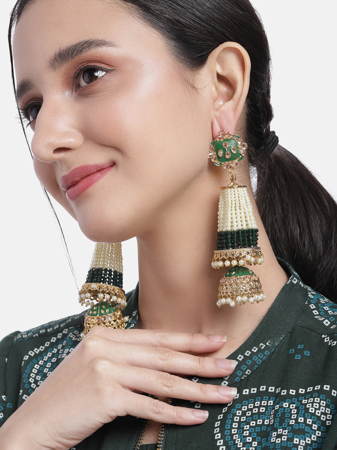 Peora Gold-Plated Dome Shaped Jhumkas Earrings
Peora Gold-Plated Dome Shaped Jhumkas Earrings