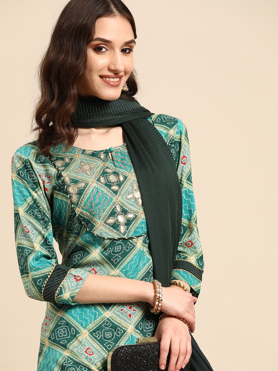 Sangria Women Teal Blue & Green Bandhani Print Mirror Work Kurta with Trousers & Dupatta
Sangria Women Teal Blue & Green Bandhani Print Mirror Work Kurta with Trousers & Dupatta