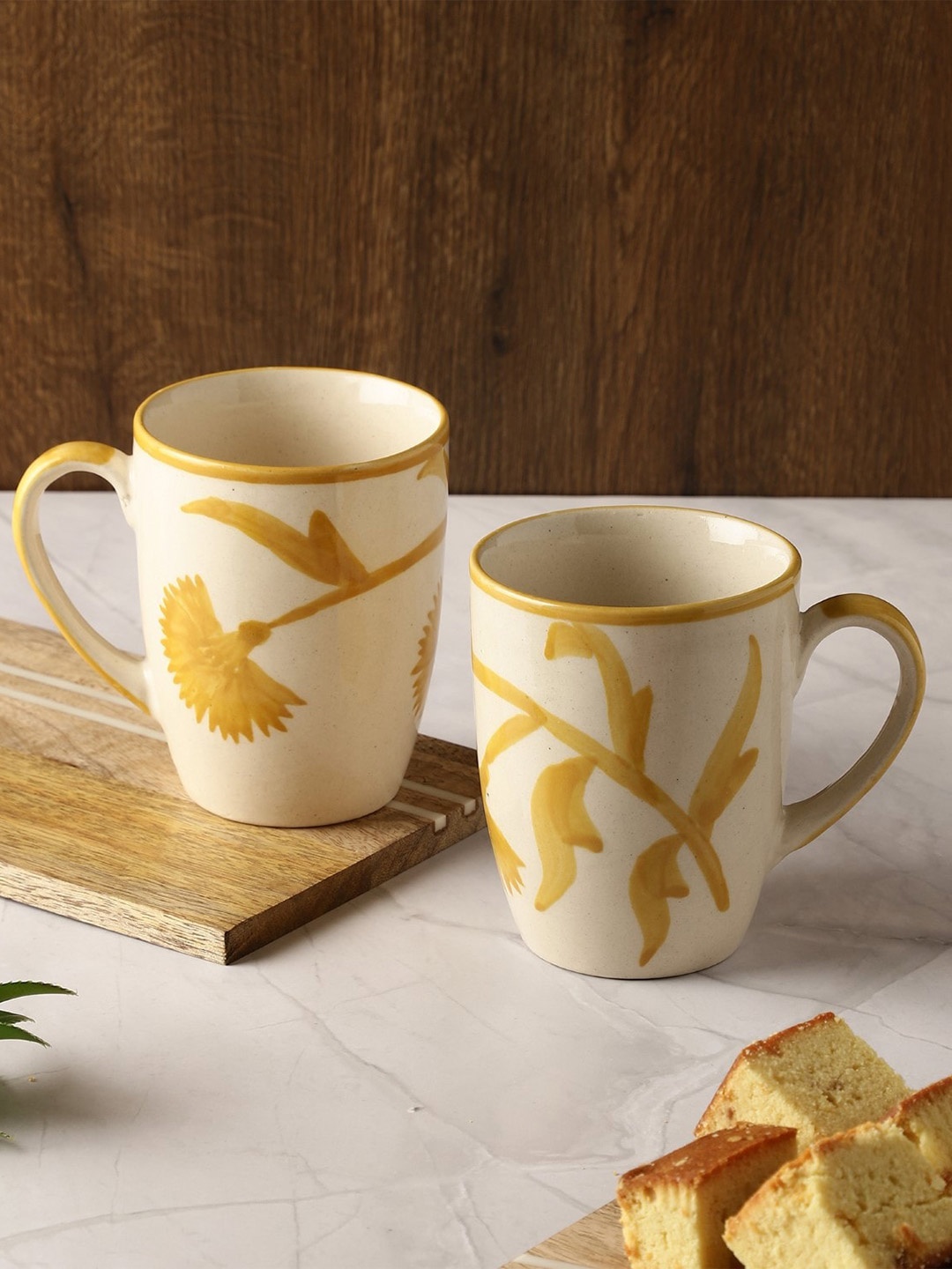 The Decor Mart Off White & Yellow Set of 2 Hand Painted Ceramic Glossy Mugs 270 ml Each
The Decor Mart Off White & Yellow Set of 2 Hand Painted Ceramic Glossy Mugs 270 ml Each