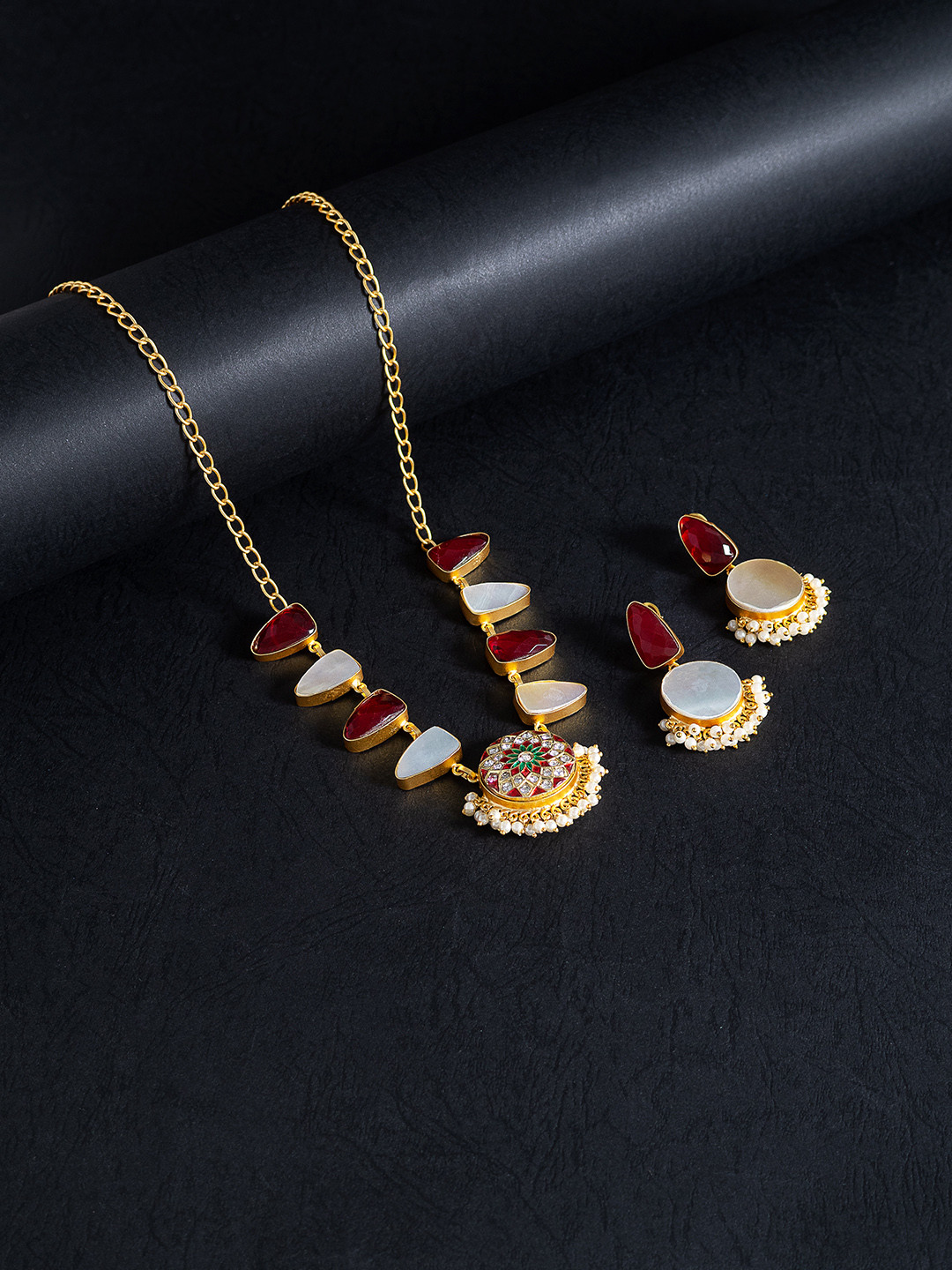 Golden Peacock Gold-Toned & Maroon Mother Of Pearls Stones Studded Meenakari Jewellery Set
Golden Peacock Gold-Toned & Maroon Mother Of Pearls Stones Studded Meenakari Jewellery Set