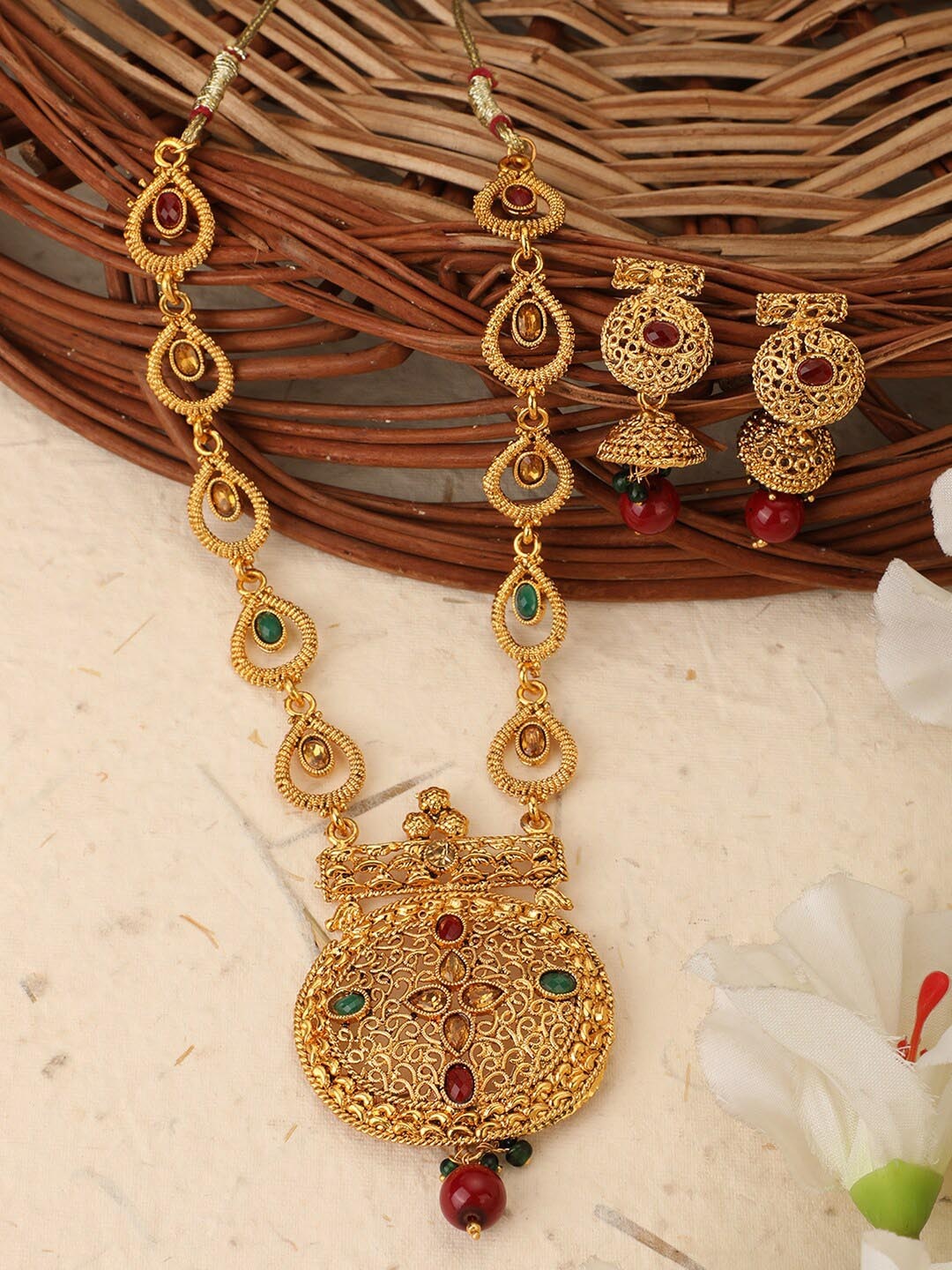 ANIKAS CREATION Gold-Plated & Red Stones-Studded & Pearl Beaded Traditional Jewellery Set
ANIKAS CREATION Gold-Plated & Red Stones-Studded & Pearl Beaded Traditional Jewellery Set