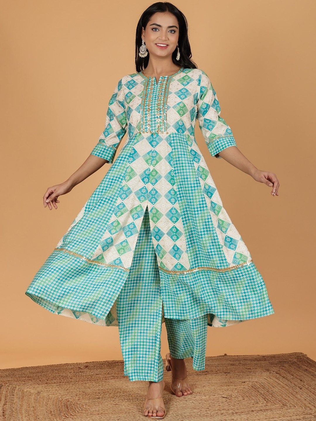 Aramya Women Printed Panelled Mirror Work Chanderi Cotton Kurta with Palazzos, Cream
Aramya Women Printed Panelled Mirror Work Chanderi Cotton Kurta with Palazzos, Cream