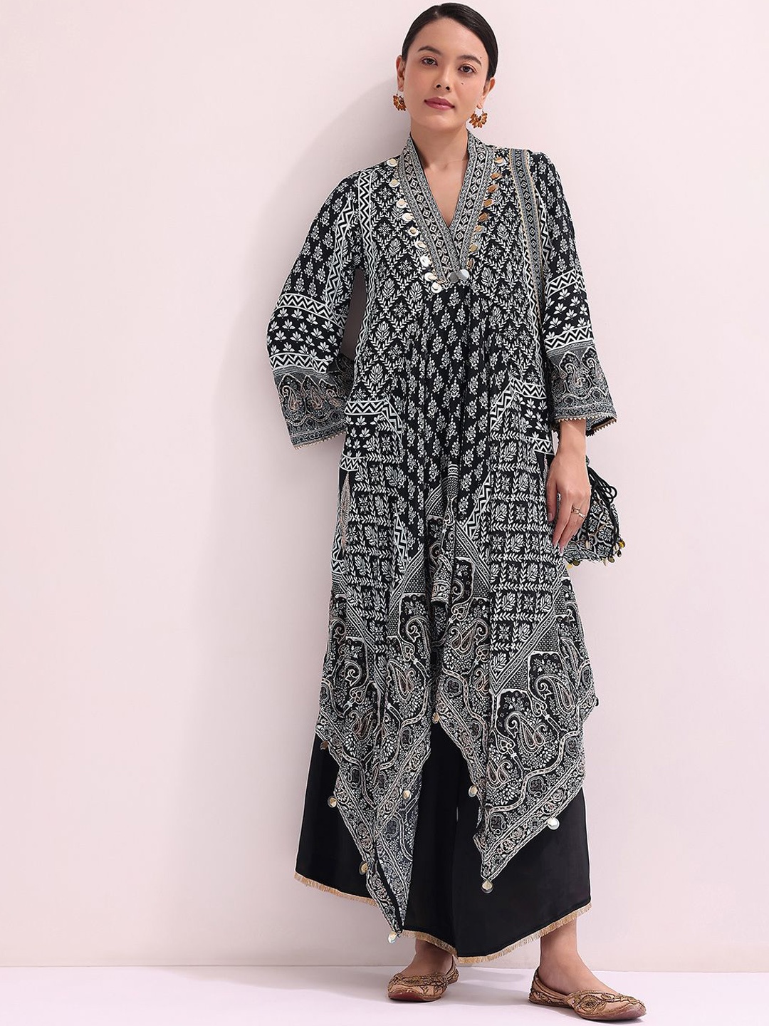 KALKI Fashion Ethnic Motifs Printed Flared Sleeves A-Line Kurta with Palazzos & Potli Bag, Black
KALKI Fashion Ethnic Motifs Printed Flared Sleeves A-Line Kurta with Palazzos & Potli Bag, Black