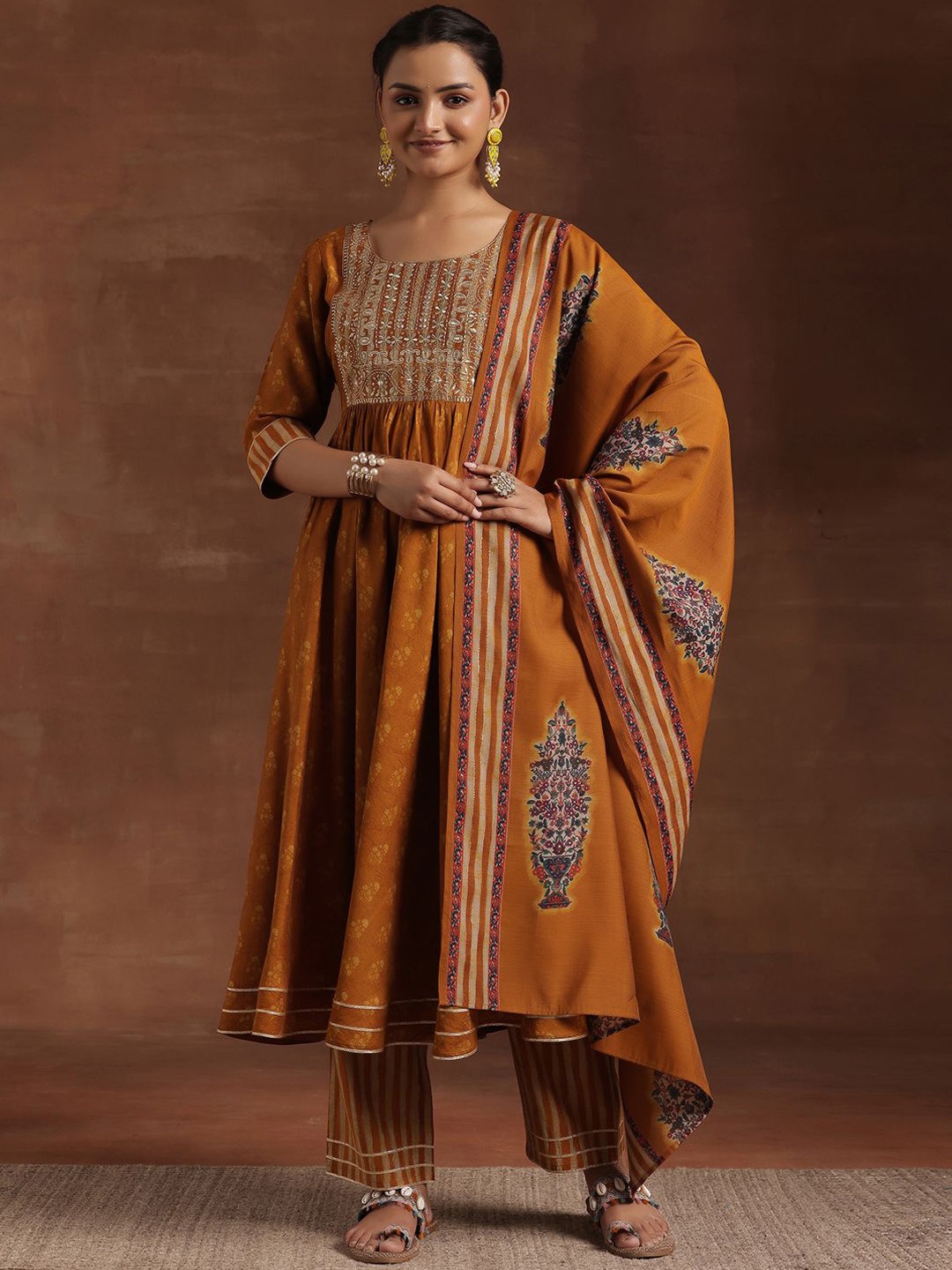 Libas Floral Printed Thread Work Pleated Anarkali Kurta with Trousers & Dupatta, Mustard
Libas Floral Printed Thread Work Pleated Anarkali Kurta with Trousers & Dupatta, Mustard