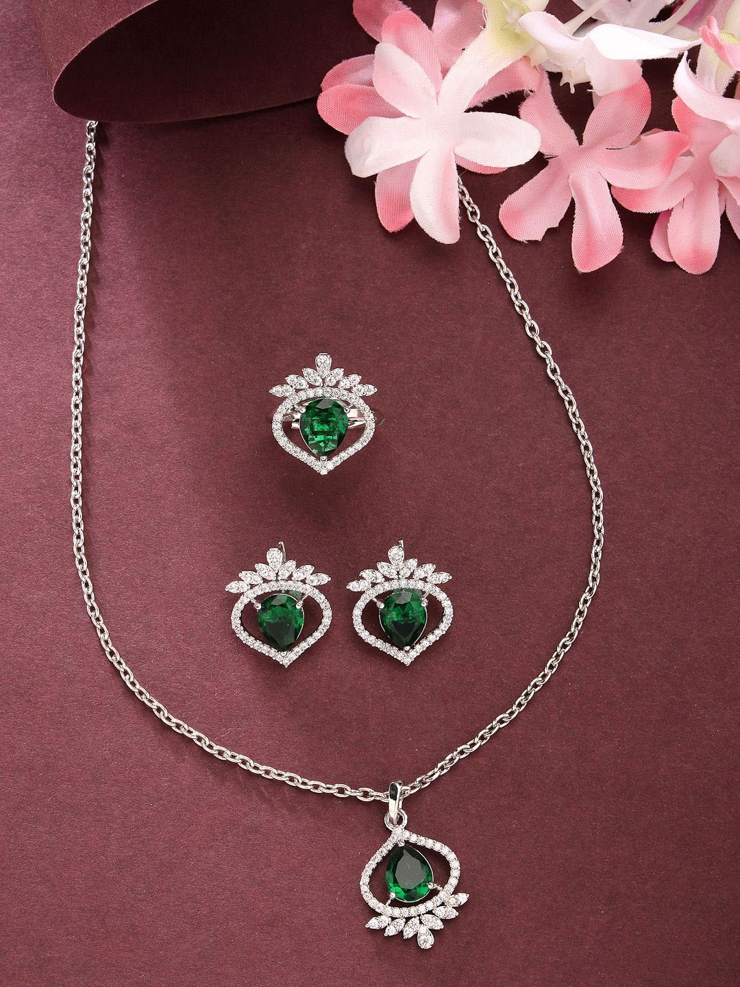 ZENEME Rhodium Plated AD Studded Trilliant Crystal Emerald Necklace and Earrings With Ring, Silver
ZENEME Rhodium Plated AD Studded Trilliant Crystal Emerald Necklace and Earrings With Ring, Silver