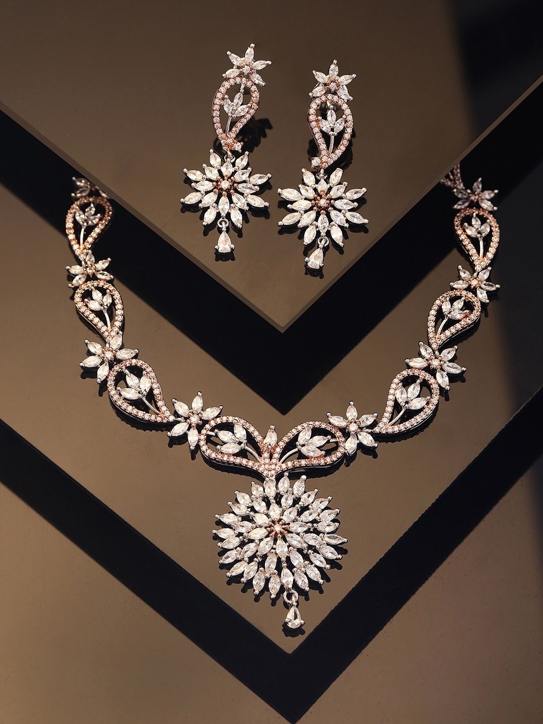Priyaasi Dual Elegance Rose Gold Plated American Diamond Stone Studded Jewellery Set
Priyaasi Dual Elegance Rose Gold Plated American Diamond Stone Studded Jewellery Set