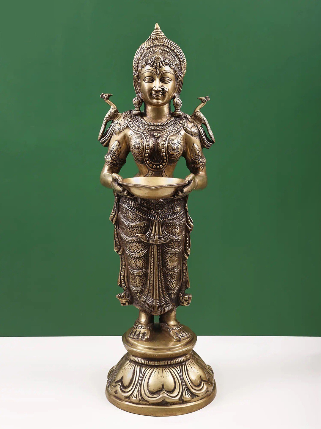 Exotic India 30" Goddess Deeplakshmi Brass Figurines - Spiritual Housewarming Gift, Metallic
Exotic India 30" Goddess Deeplakshmi Brass Figurines - Spiritual Housewarming Gift, Metallic