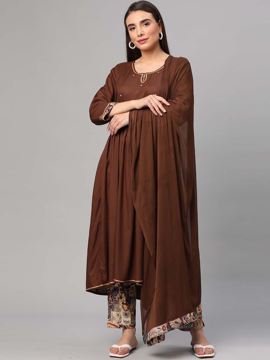 Shree Floral Printed Pleated Beads and Stones Liva Kurta With Trousers & Dupatta, Brown
Shree Floral Printed Pleated Beads and Stones Liva Kurta With Trousers & Dupatta, Brown