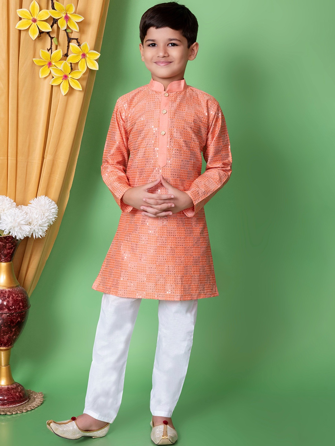 NFC CREATION Boys Embroidered Mandarin Collar Sequinned Dupion Silk Kurta with Pyjama, Peach
NFC CREATION Boys Embroidered Mandarin Collar Sequinned Dupion Silk Kurta with Pyjama, Peach
