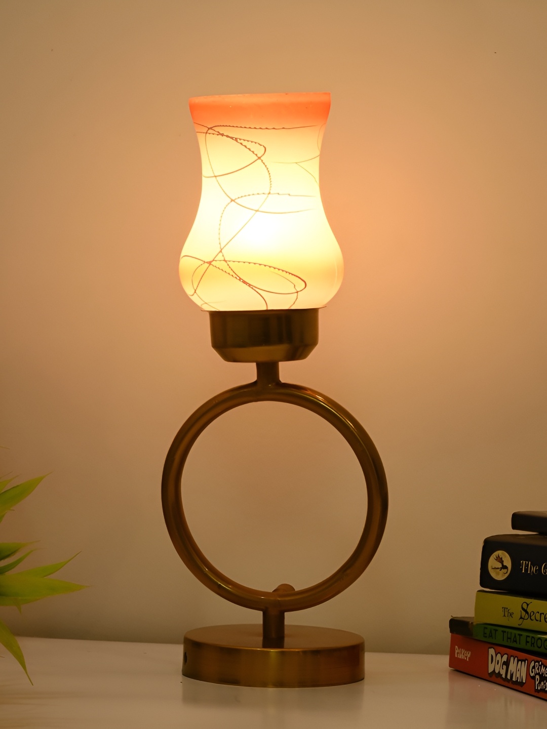 Afast Orange & Gold Toned Printed Bell Shaped Glass Table Lamp With Adjustable Cord
Afast Orange & Gold Toned Printed Bell Shaped Glass Table Lamp With Adjustable Cord