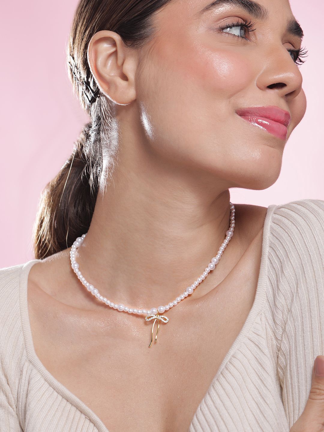 Rubans 18K Gold-Plated White Pearl Beaded Necklace with Zicronia Studded Golden Bow Charm
Rubans 18K Gold-Plated White Pearl Beaded Necklace with Zicronia Studded Golden Bow Charm